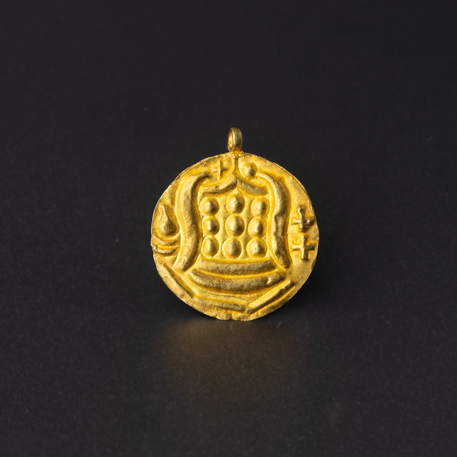 Disc Pendant with a Nine-Bossed Emblem