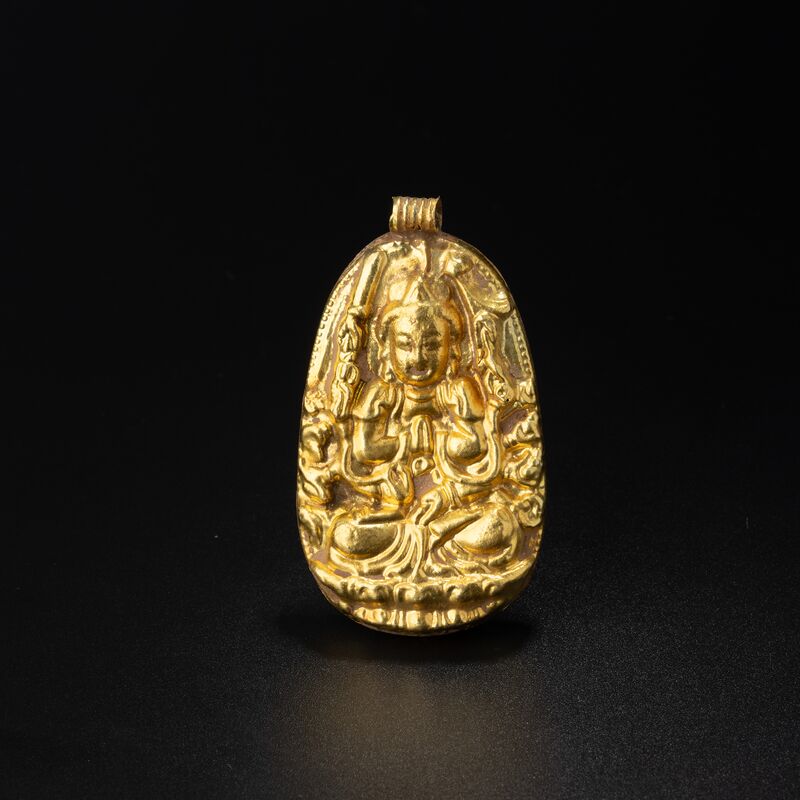 Pendant with a Many-Armed Seated Deity