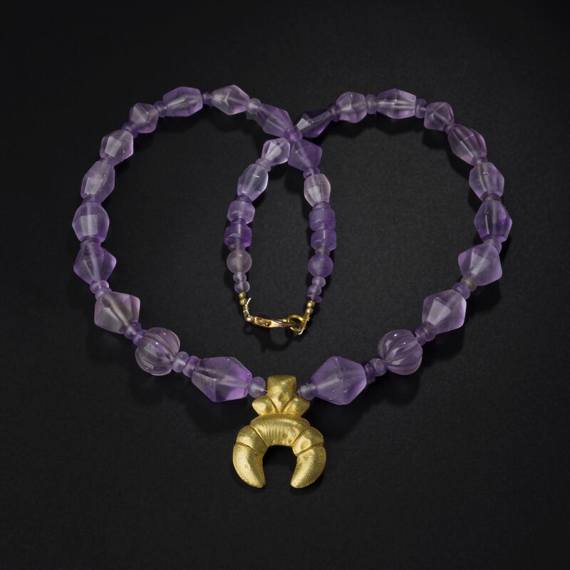 Necklace of Faceted Purple Beads with a Gold Crescent