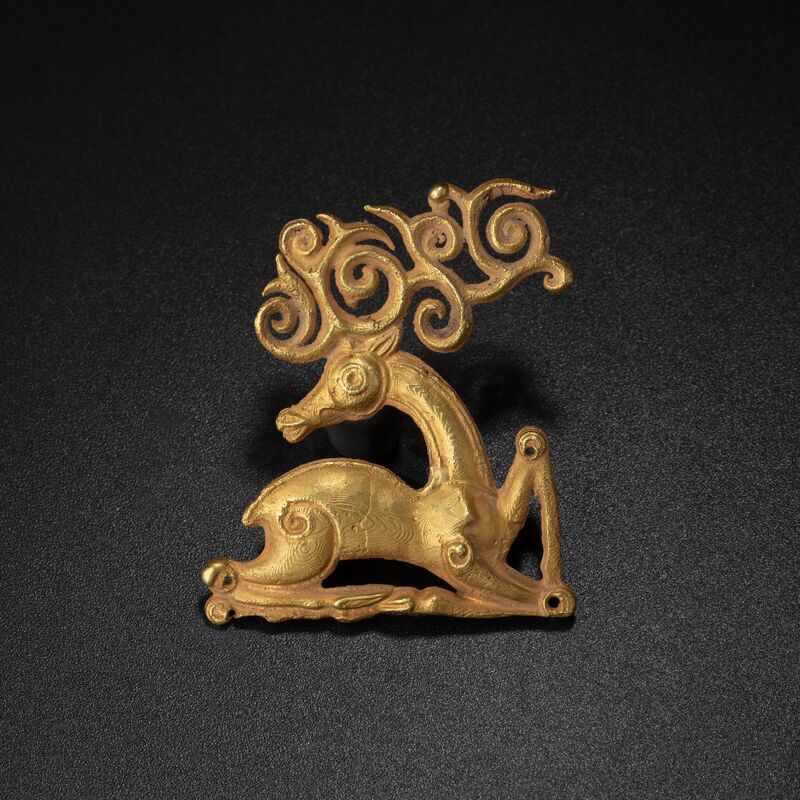 Recumbent Stag with Scrolling Antlers