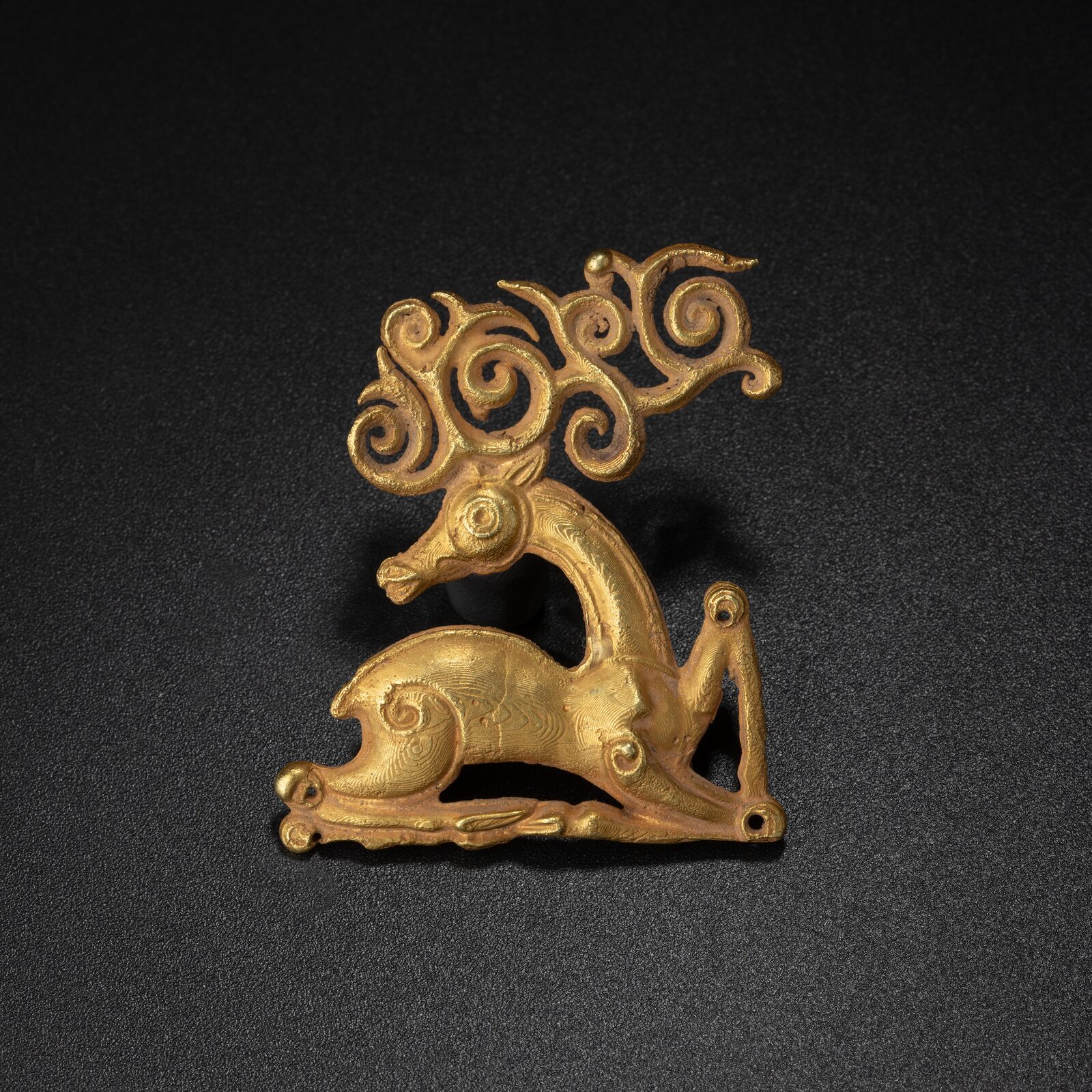 Recumbent Stag with Scrolling Antlers