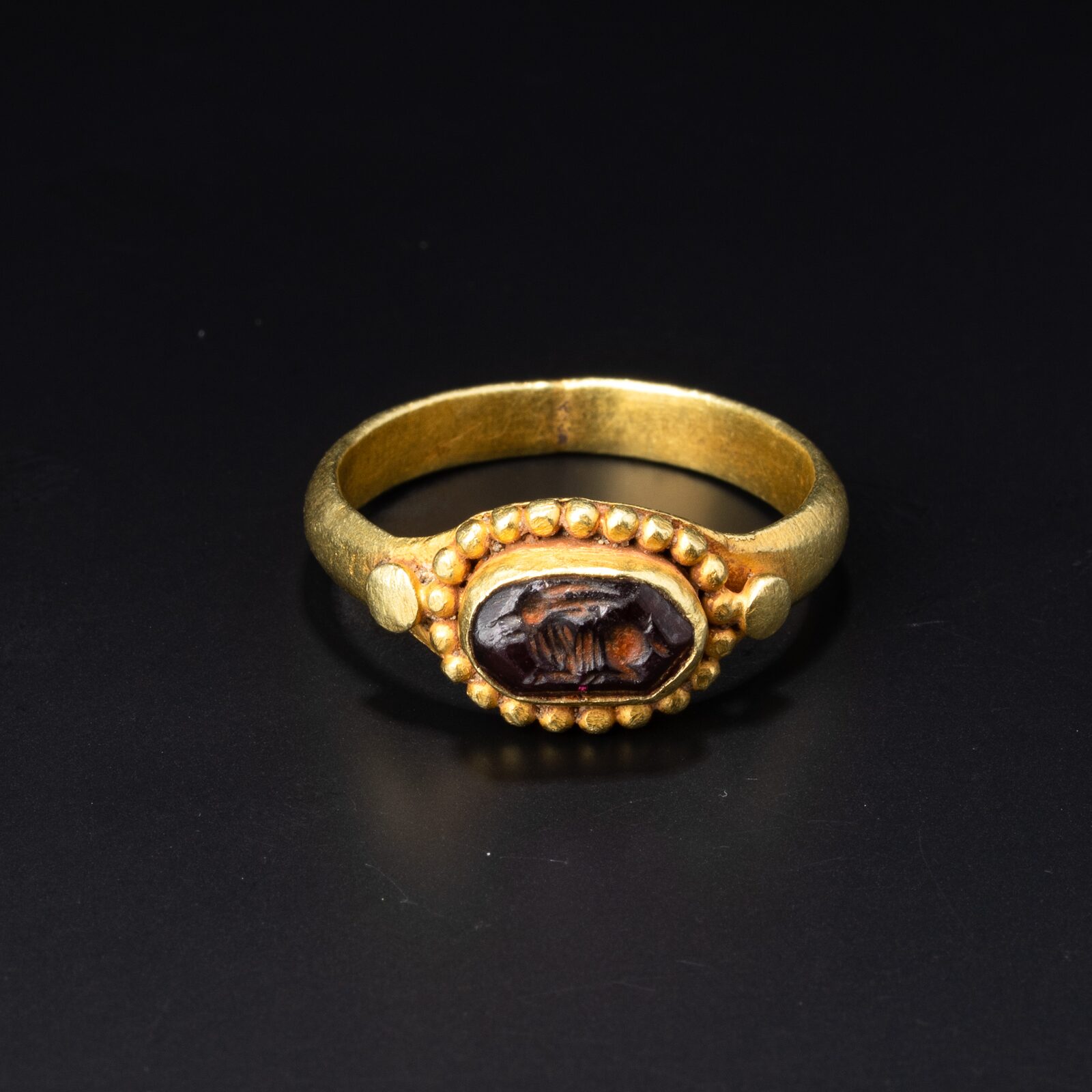 Ring with an Engraved Dark Red Stone