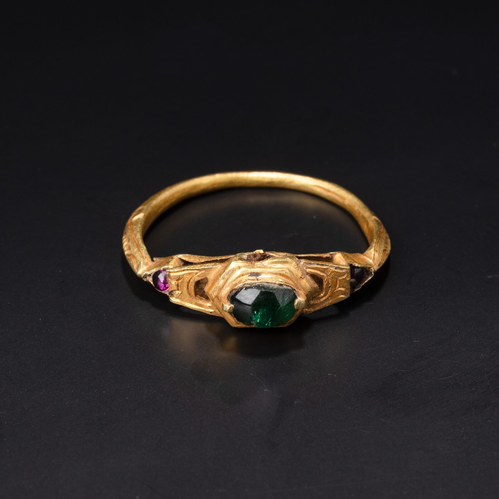 Ring with a Green Stone and Scrolled Shoulders