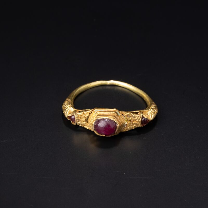 Ring with a Red Stone in a Stepped Setting