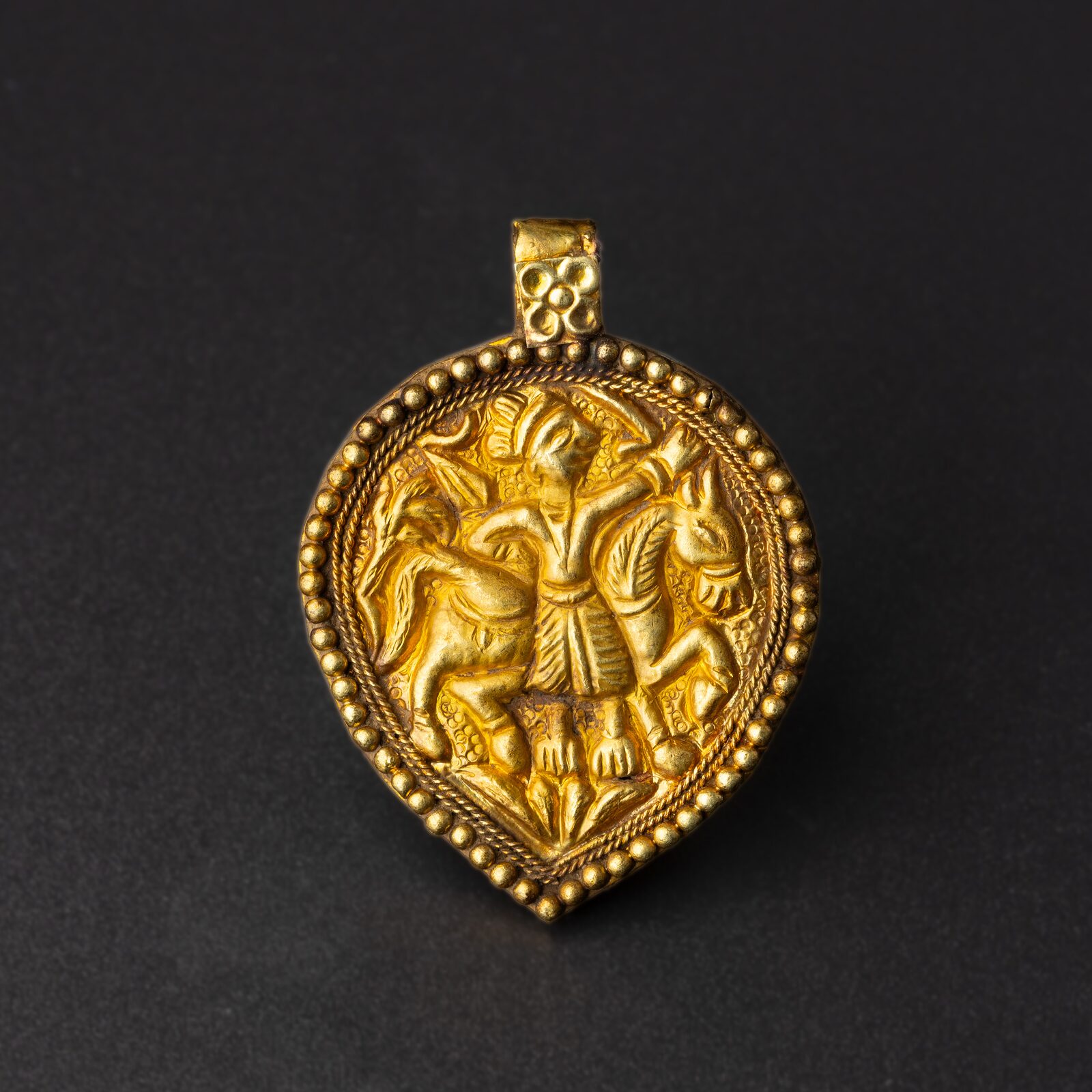 Teardrop Pendant with a Figure Between Two Horses